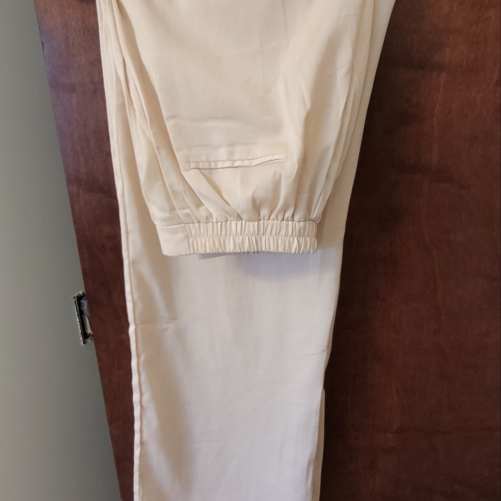 Satin pants, cream colored, size large.
